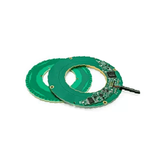 A pair of green circular pads with a circuit board on top.